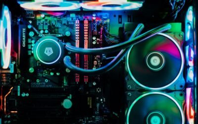nterior of a custom-built desktop computer with RGB lighting, liquid cooling tubes, dual radiator fans, and illuminated RAM modules on a GIGABYTE motherboard
